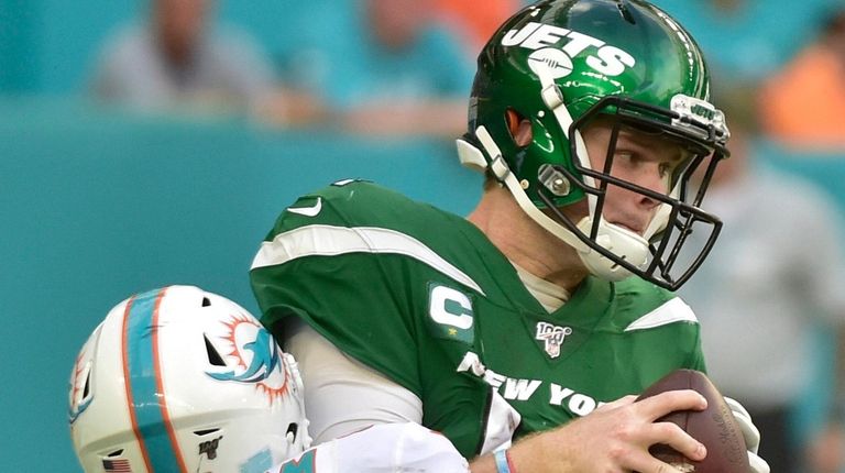 Nik Needham of the Dolphins sacks Sam Darnold