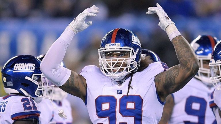 Giants defensive end Leonard Williams motions after a