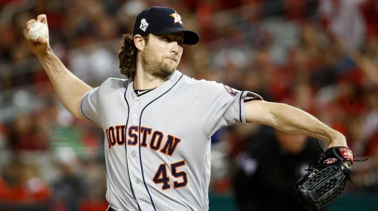 Astros starting pitcher Gerrit Cole throws against the