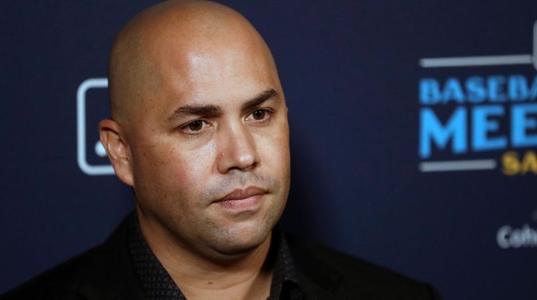 Mets manager Carlos Beltran listens to a question