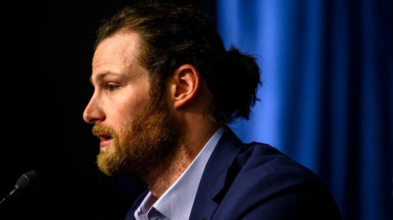 Gerrit Cole speaks to the media in a
