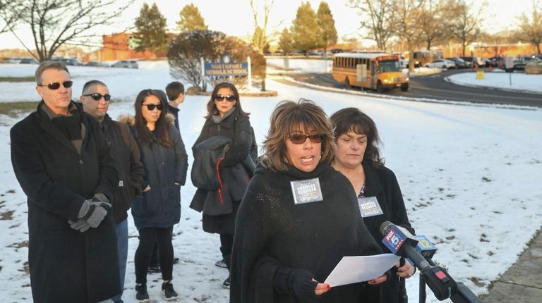 Northport resident Tammie Topel, front, whose two children