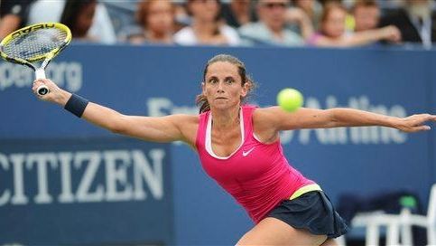 Italy's Sara Errani returns a shot to Germany's