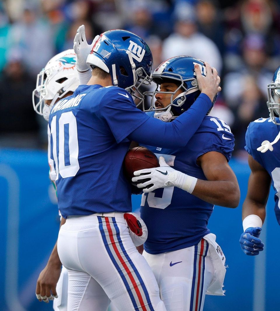 Eli Manning #10 and Golden Tate #15 of