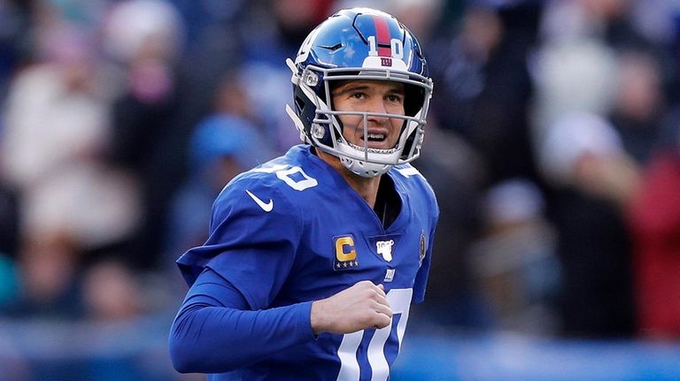 Eli Manning of the Giants celebrates after throwing