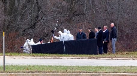 New York State Police investigate the scene where