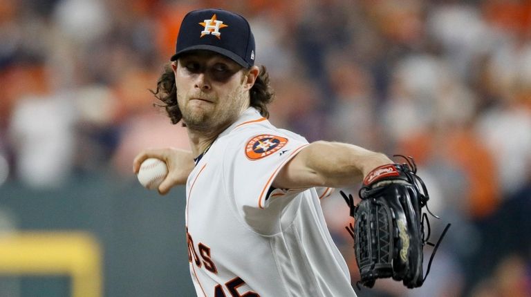 Astros starting pitcher Gerrit Cole throws against the