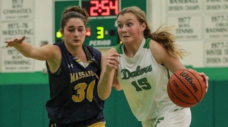 Kelly Bergersen (18 points) drives to basket past