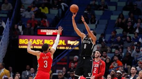 Nets guard Spencer Dinwiddie (8) attempts a 3-point