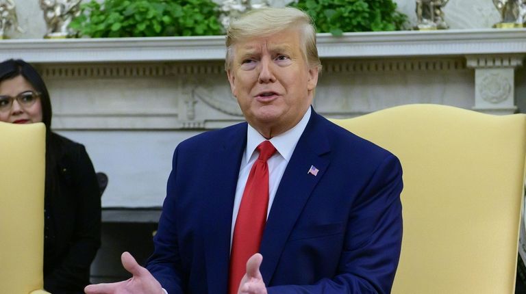 President Donald Trump speaks in the Oval Office
