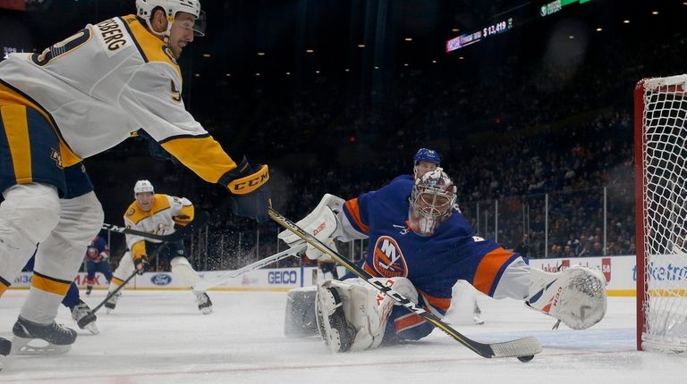 Semyon Varlamov #40 of the Islanders defends the