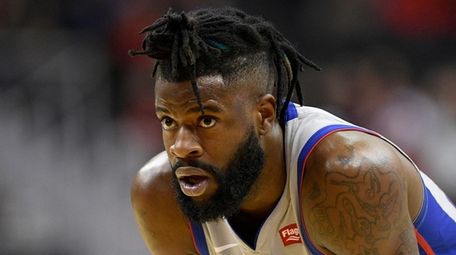 Reggie Bullock stands on the court during the