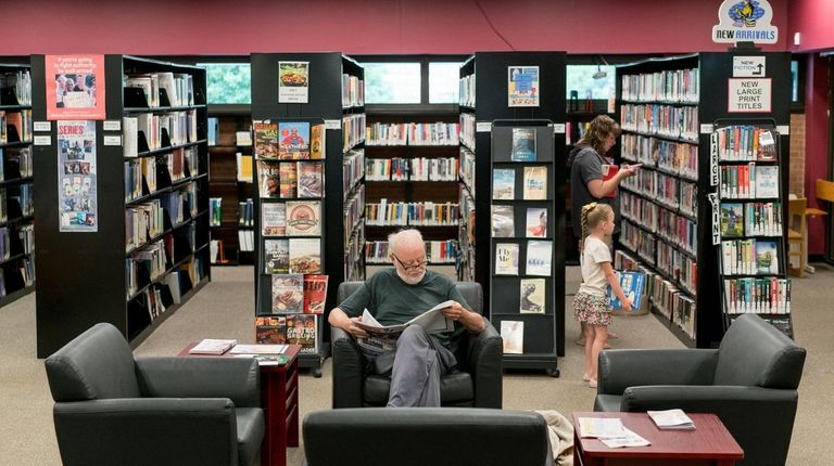 Guests visit Lindenhurst Library on June 7, 2017.