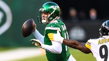 Sam Darnold, here eluding Steelers linebacker Ola Adeniyi,