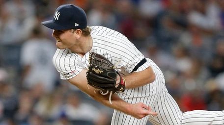 Chance Adams of the Yankees pitches against the