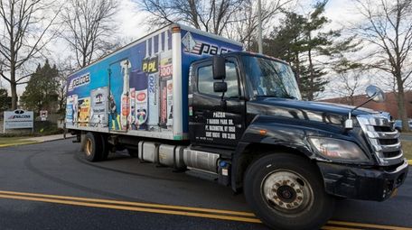A truck leaves PACOA's distribution center in Port