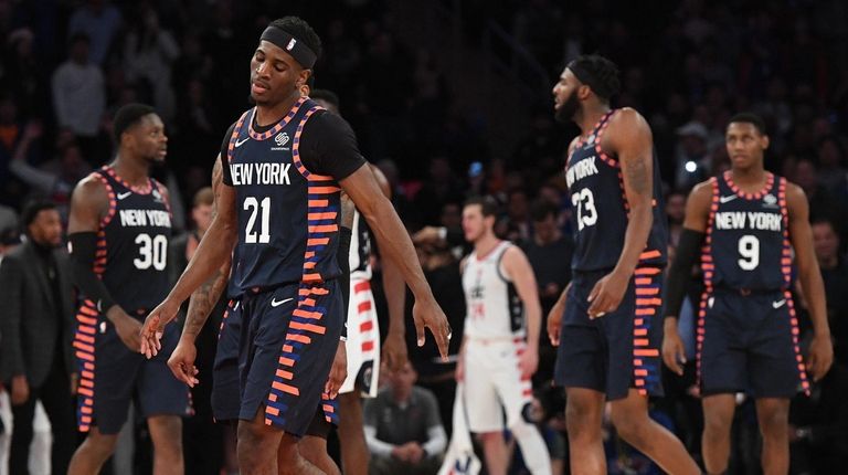 Knicks guard Damyean Dotson and teammates react with
