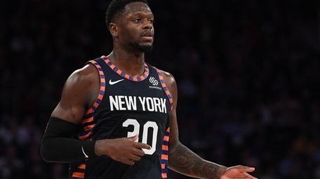 New York Knicks forward Julius Randle looks on