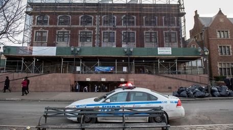 An NYPD patrol car guards the Chabad Lubavitch