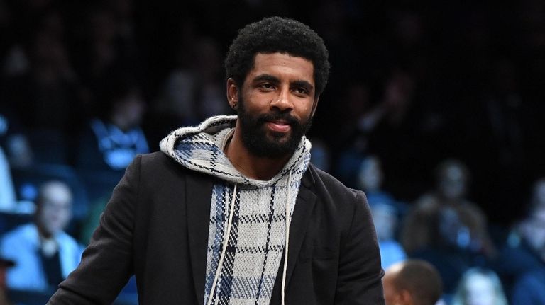 Nets' Kyrie Irving looks on during the second