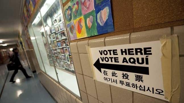 A voter enters a polling station in a