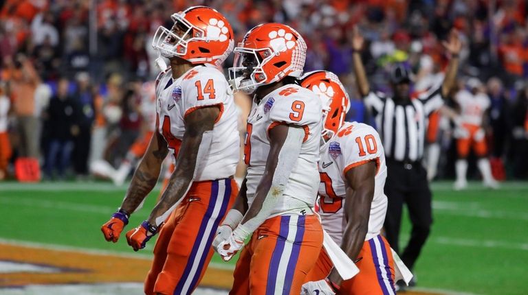 Clemson running back Travis Etienne (9) celebrates after
