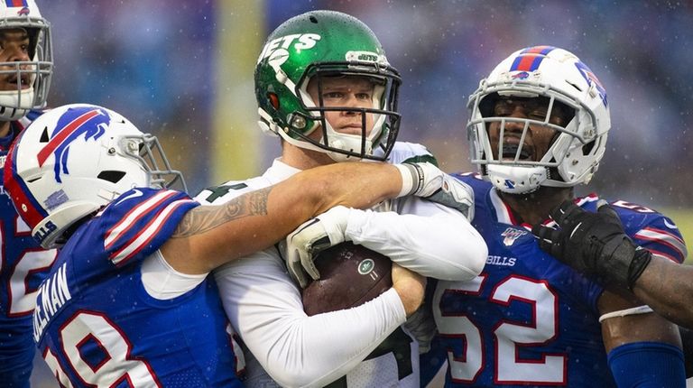 Sam Darnold of the Jets stands with the