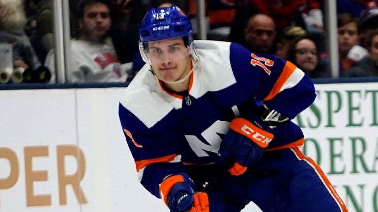 Islanders center Mathew Barzal brings the puck up