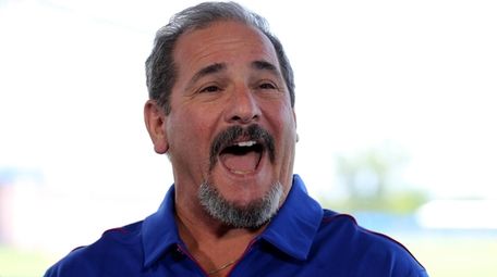 Giants general manager Dave Gettleman talks to the