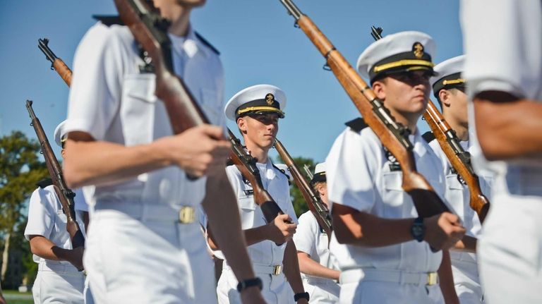 Freshman students are sworn in by Rear Admiral