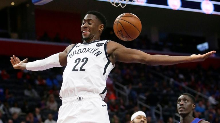 Nets guard Caris LeVert dunks against the Pistons