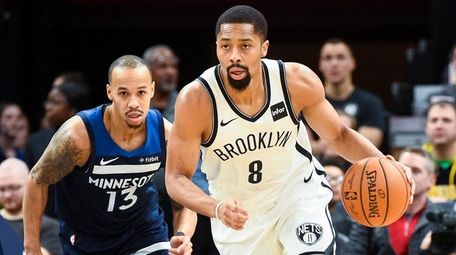 Nets guard Spencer Dinwiddie brings the ball downcourt