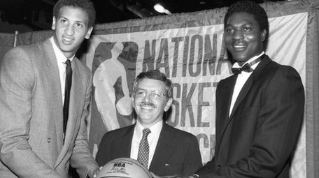NBA commissioner David Stern, center, is flanked by