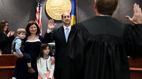 Robert Calarco (D-Patchogue) is sworn in as presiding