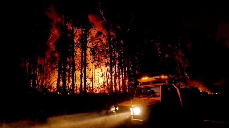 Crews monitor fires and begin back burns between
