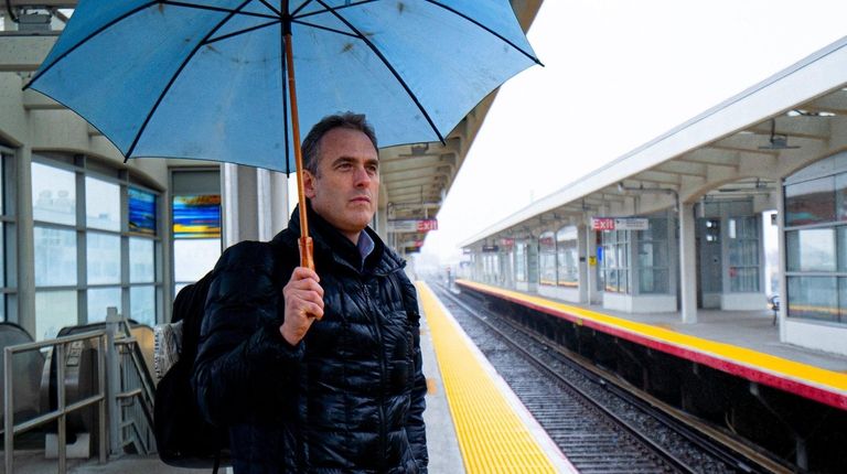 Darren Kotchek of Plainview waits for a train