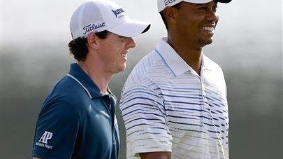 Tiger Woods and Rory McIlroy walk up the