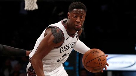 Caris LeVert of the Nets controls the ball