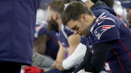 Tom Brady of the Patriots reacts as he