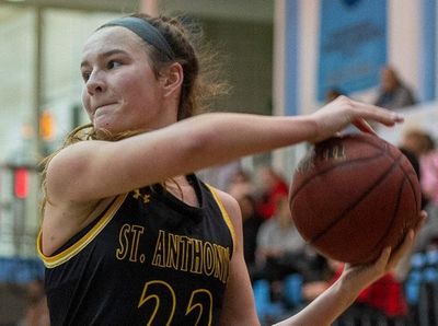 St. Anthony's Colleen McCullagh works against a Moore