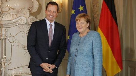 U.S. Ambassador Richard Grenell and Chancellor Angela Merkel