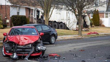 A garbage truck destroyed a car and seriously
