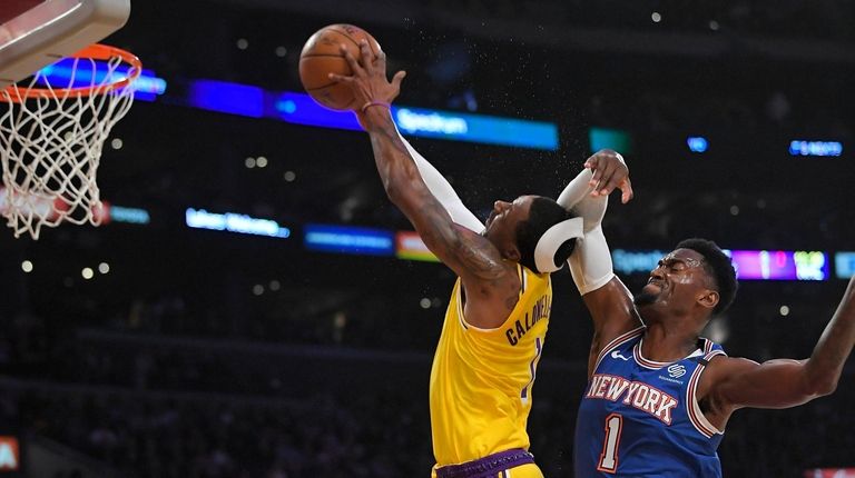 Knicks forward Bobby Portis, right, fouls Los Angeles