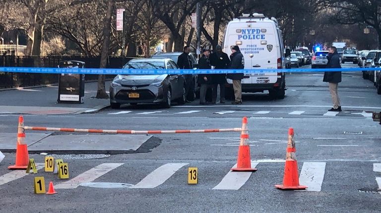NYPD detectives on Thursday investigate the fatal shootings