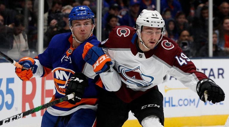 Anthony Beauvillier of the Islanders and Samuel Girard