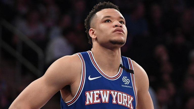 Knicks forward Kevin Knox II looks on during