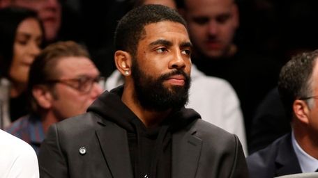 Kyrie Irving of the Brooklyn Nets looks on