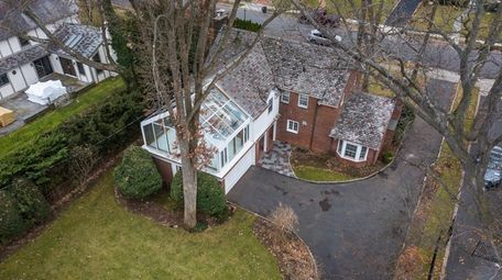 This Rockville Centre brick Colonial is listed for