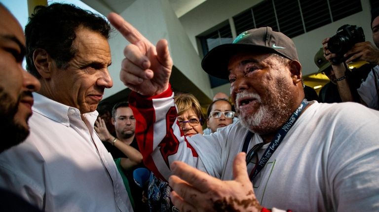 Gov. Andrew M. Cuomo speaks with a resident