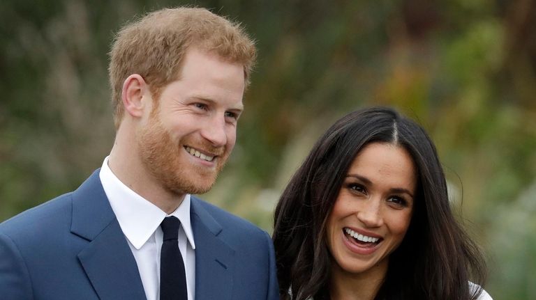 Britain's Prince Harry and Meghan Markle pose for